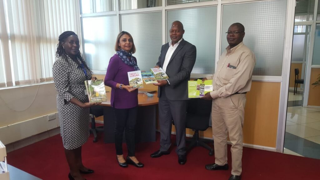 Dr. Najma Dharani donating books to the Kenyatta University Post Modern Library